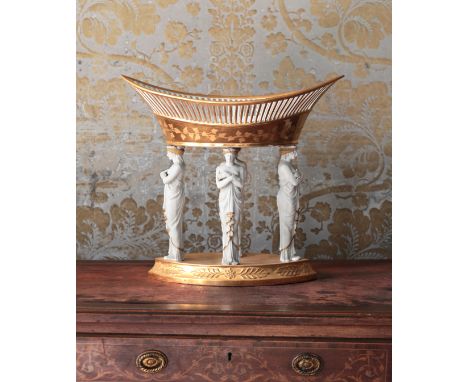 A NEOCLASSICAL PARIS PORCELAIN FRUIT COMPOTE19th century, the gilt pierced oval bowl on four female caryatid supports and a g