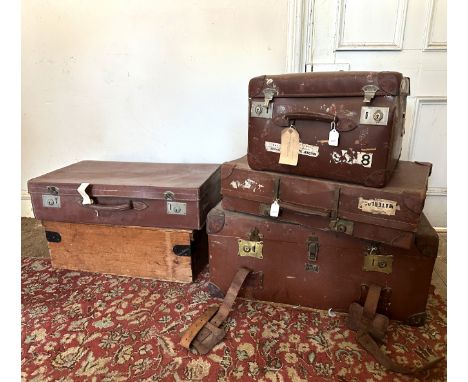 A COLLECTION OF VINTAGE LUGGAGE including a canvas trunk by Pukka Luggage, 76cm wide, two brown leather suitcases, a small le