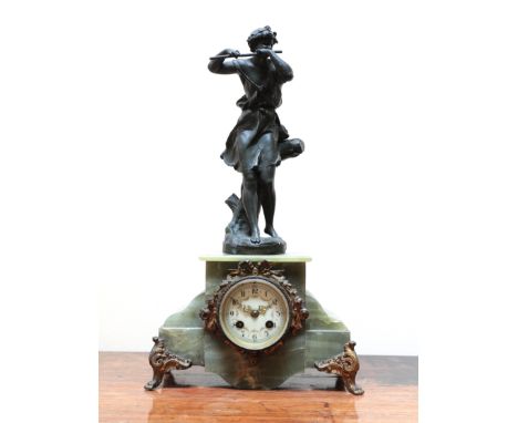 A FRENCH ONYX AND SPELTER FIGURAL MANTEL CLOCK20th century, the case mounted with a flute player after Ernest Justine Ferrand