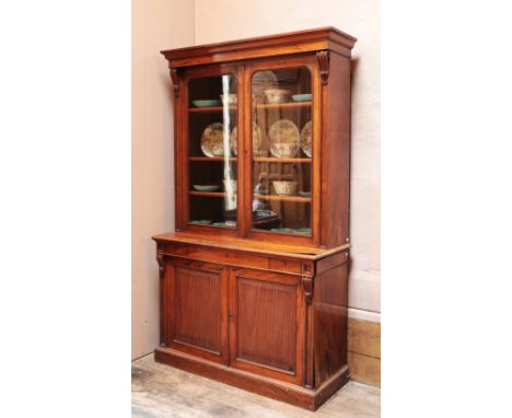 A VICTORIAN WALNUT SECRETAIRE BOOKCASE the upper section with a moulded cornice over a glazed cupboard opening to shelves, th