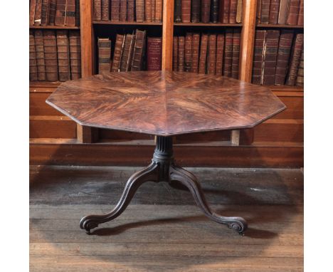 A GEORGE III MAHOGANY BREAKFAST TABLE ATTRIBUTED TO THOMAS CHIPPENDALE the decagonal tilt-top with ten segmented flamed mahog