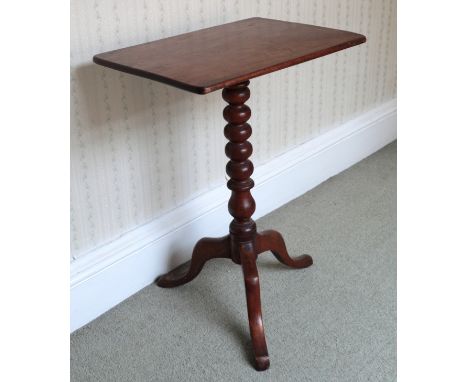 A VICTORIAN MAHOGANY TRIPOD TABLEthe rectangular tilt top on bobbin turned stem, cabriole legs and pad feet, 68cm high x 50cm