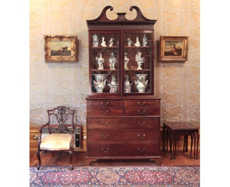A GEORGE III MAHOGANY SECRETAIRE BOOKCASE the upper section with a tall broken swan-neck pediment over a dentil moulded friez