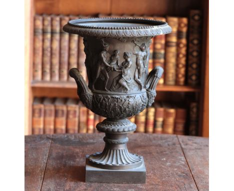 A NEOCLASSICAL PATINATED BRONZE VASE of bell-shaped krater form, the body decorated in relief with a Dionysian procession, in