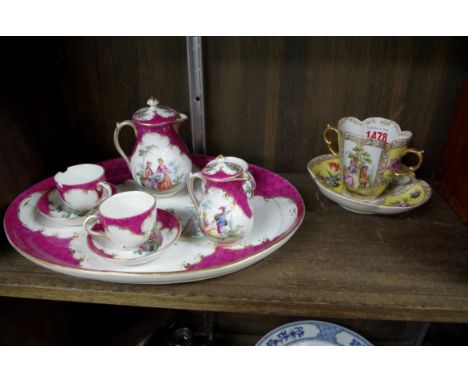 A Berlin porcelain cabaret service, the tray 29.5cm wide; together with a Dresden cabinet cup and saucer.