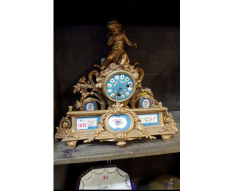 A late 19th century gilt spelter and porcelain mounted mantel clock, 38cm wide. 