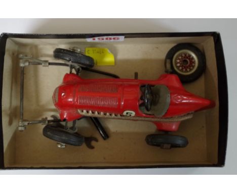 A Schuco 'Studio 1050' clockwork grand prix car, with spanner, key and jack. 