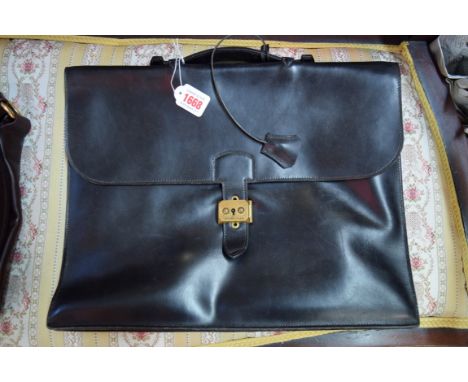 An Hermes black leather briefcase, with two original keys.  