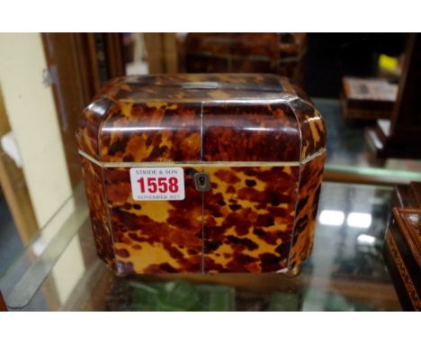 An early 19th century blonde tortoiseshell tea caddy, with silver wire inlay, 15.5cm wide.