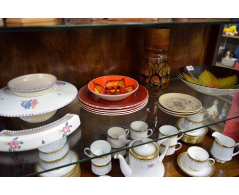 A collection of Poole pottery.