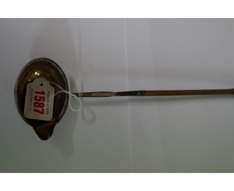 A silver and balleen toddy ladle.
