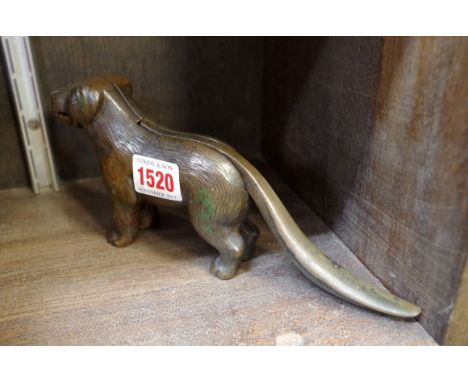 A patinated metal novelty dog nutcracker. 