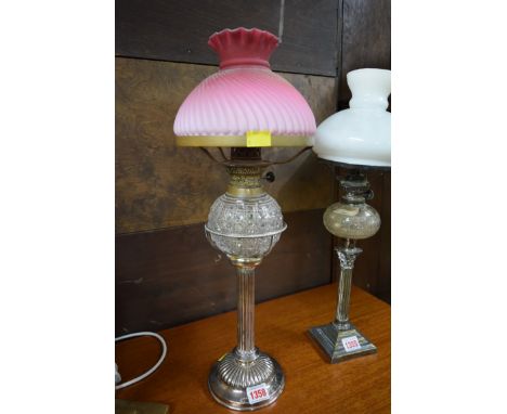 An electroplated oil lamp, with hobnail cut glass reservoir and Thomas Webb style shade, 51cm high.