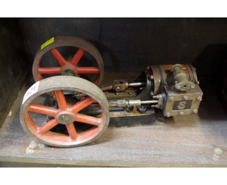 An antique Stuart stationary steam engine. 28cm long.