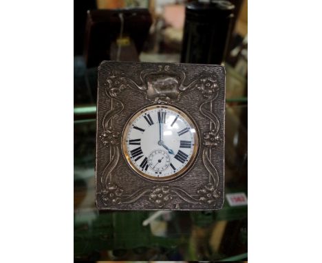 A Victorian electroplate Goliath pocket watch, with subsidiary seconds dial, in an Art Nouveau silver case, with easel back.