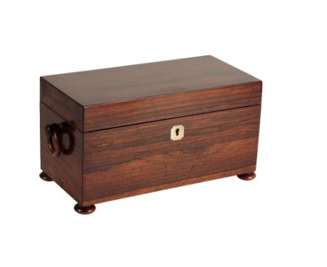 A LATE REGENCY ROSEWOOD TEA CADDY of rectangular form, the hinged cover opening to two interior lidded compartments and cut-g