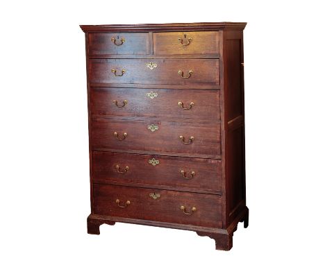 A GEORGE III OAK AND CROSSBANDED MAHOGANY TALLBOY CHEST OF DRAWERS the two frieze drawers with brass swan-neck handles and fi