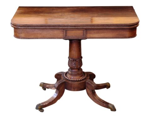 A REGENCY ROSEWOOD CARD TABLE the folding rectangular top with a baize-lined interior and a reeded edge, over a panelled frie