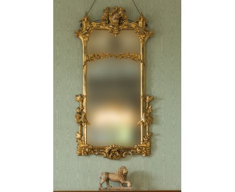 A CHIPPENDALE REVIVAL&nbsp;"CHINOISERIE" GILTWOOD WALL MIRROR the rectangular plate within a pierced surround carved with rib
