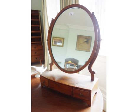 A SHERATON STYLE INLAID MAHOGANY DRESSING MIRROR the oval plate on a box base with three drawers and bracket feet, 18" wide 