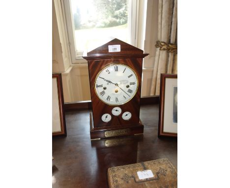A REGENCY STYLE "MILLENNIUM 2000" MAHOGANY MANTEL CLOCK of architectural form, the white enamel dial with Roman numerals encl