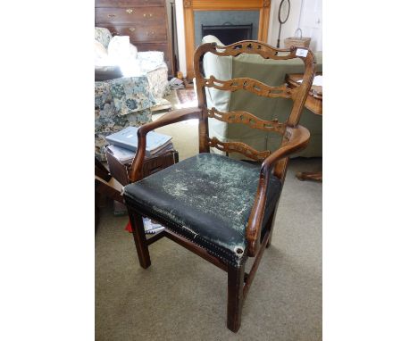 A GEORGE III HEPPLEWHITE STYLE MAHOGANY ELBOW CHAIR with pierced ladder back, leather-upholstered and brass close-nailed seat