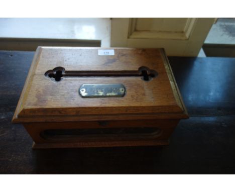 A LATE VICTORIAN “ARTS AND CRAFTS” LIGHT OAK BOX with a brass tablet inscribed “Letters”, 13" wide 