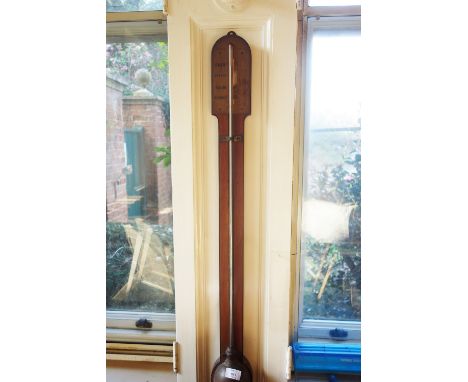 A VICTORIAN STICK BAROMETER by Braham, Bath, with a domed top and turned base cistern, 35" 