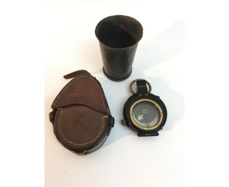 A WWI leather cased military compass by T.Cooke and a small bronzed beaker
