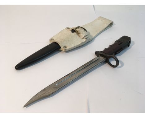 A No 7 British bayonet for the Jungle Carbine with frog and scabbard.