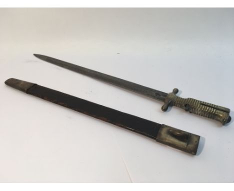 A rare piedemonte pattern Italian bayonet with leather and brass mounted scabbard.