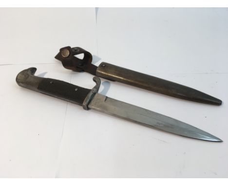 A WW1 Eickorn made fighting knife, checkered leather grips with a early Eickorn logo , bright clean blade and a scabbard with