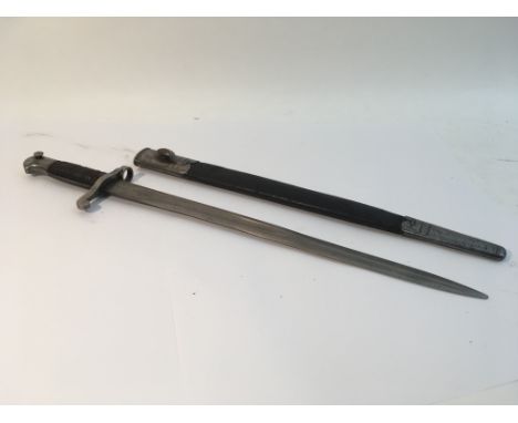 A Victorian bayonet for the Martini Henry rifle. Leather grips and scabbard in good condition.