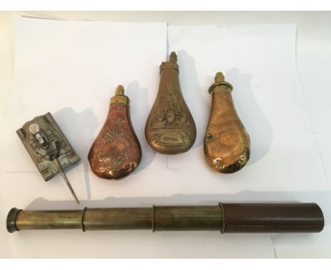 Three old powder flasks, a Dolland brass telescope and model tank
