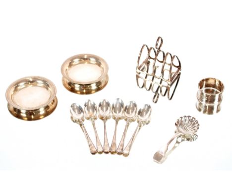 A small silver toast rack,&nbsp;Birmingham 1924; six silver coffee spoons, Sheffield 1926; a Newcastle Georgian silver caddy 