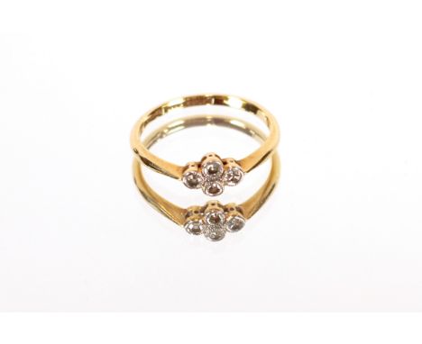 An 18ct gold and four stone set cluster ring