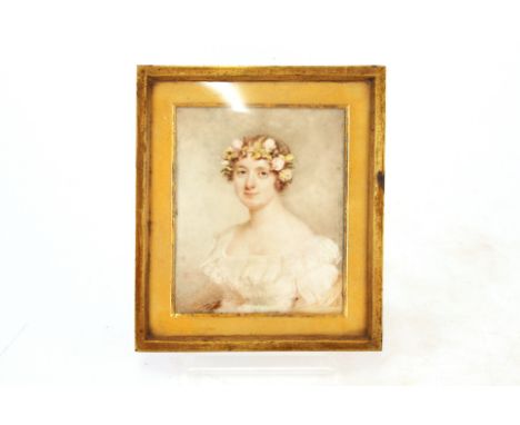 19th Century school,&nbsp;&nbsp;portrait miniature of a young lady with flowers in her hair and white lace dress