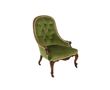 A Victorian walnut framed button back nursing chair,&nbsp;raised on cabriole supports