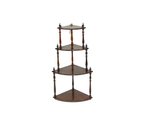 An early 19th Century rosewood bow fronted four tier graduated corner shelf,&nbsp;raised on turned supports, 72cm high&nbsp;