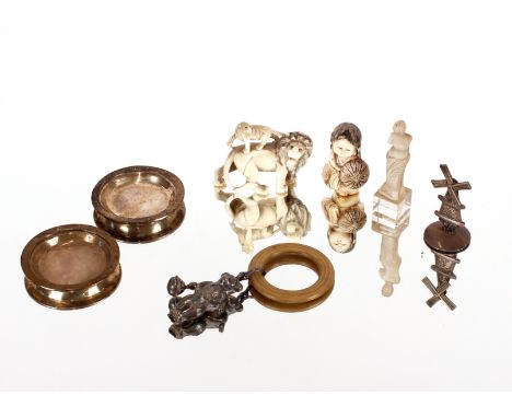 Two ivory Netsukes; a white metal model of a windmill; babies rattle / teething ring etc. 