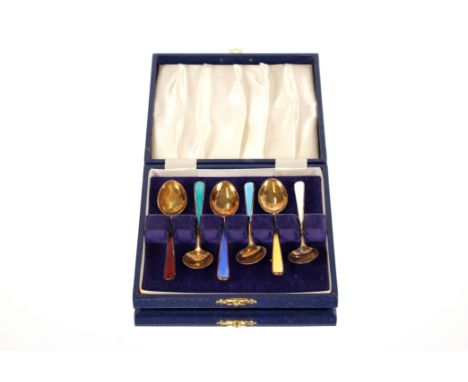 A cased set of six silver gilt and enamel coffee spoons