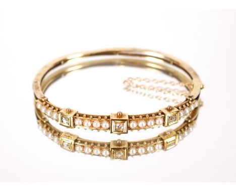A yellow metal diamond and seed pearl set bangle&nbsp;