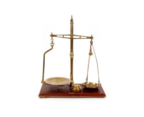 A set of brass scales,&nbsp;by W. &amp; T. Avery Birmingham, to weigh 2lbs, complete with three brass graduated weights&nbsp;