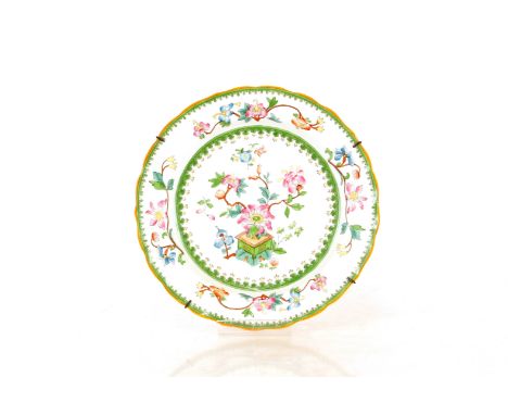A Royal Worcester part dessert set,&nbsp;decorated in the Chinese manner with scrolling flowers and jardinières, comprising o