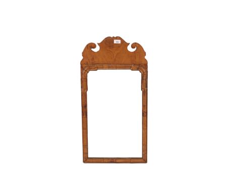 A walnut&nbsp;framed Chippendale&nbsp;design&nbsp;wall mirror,&nbsp;having fret carved pediment and cushion frieze,77cm x 40c