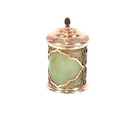 A Chinese cylindrical box and cover,&nbsp;the celadon jade body cased in elaborate white metal mounts and cover, 14cm high&nb