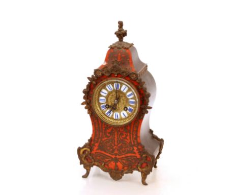 A 19th Century French ebonised&nbsp;tortoiseshell and cut brass cased mantel&nbsp;clock, in the manner of Boulle, the circula