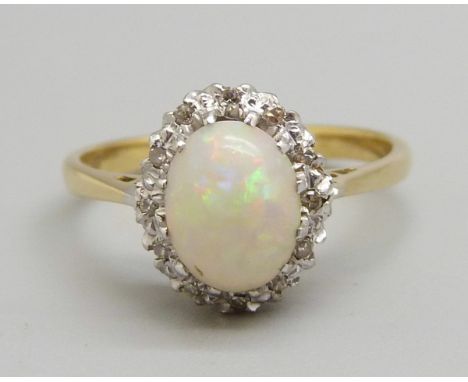 An 18ct gold and platinum, opal and diamond ring, 2.9g, L 