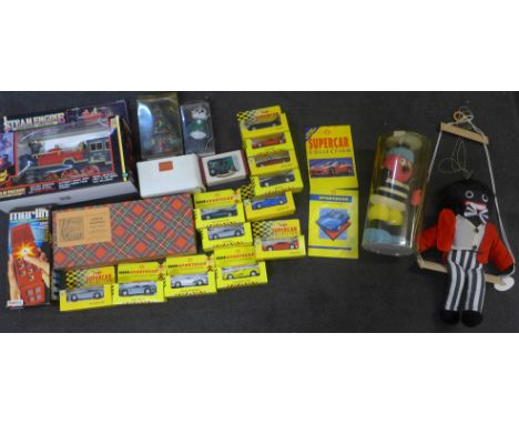 A model steam engine with smoky effect, a Merlin Electronic game, a Bertie Bassett soft toy, Junior bagpipes, sweet tins and 