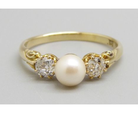 An 18ct gold two stone diamond ring with pearl centre stone, P, 2.5g, circa 0.5ct diamond weight 